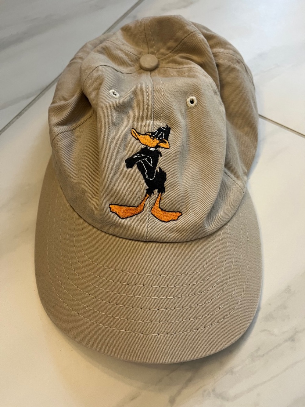 Tan Baseball Cap with Daffy Duck Embroidery